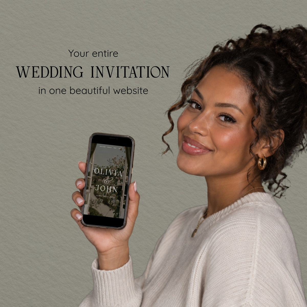 Smiling woman holding a phone that shows the olive green countryside wedding website invitation.