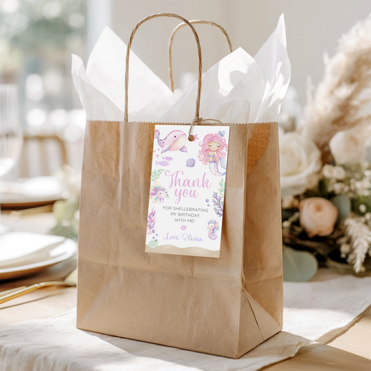 Printable mermaid favor tags attached to party favors for birthday celebratio