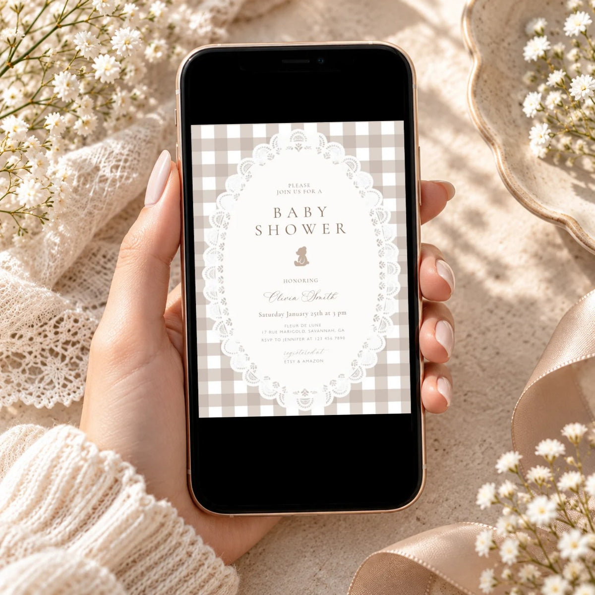 Teddy bear gingham baby shower invitation shown on a phone, ready to send by text