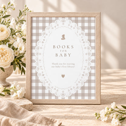 Books for Baby sign with teddy bear, white lace and beige gingham in a wooden frame with white flowers